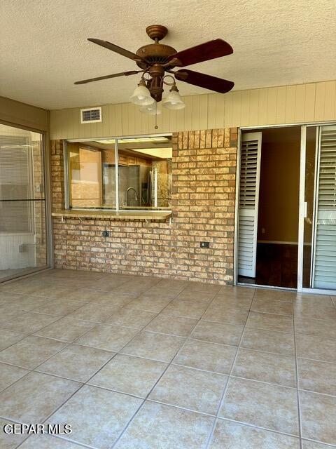 view of patio with ceiling fan