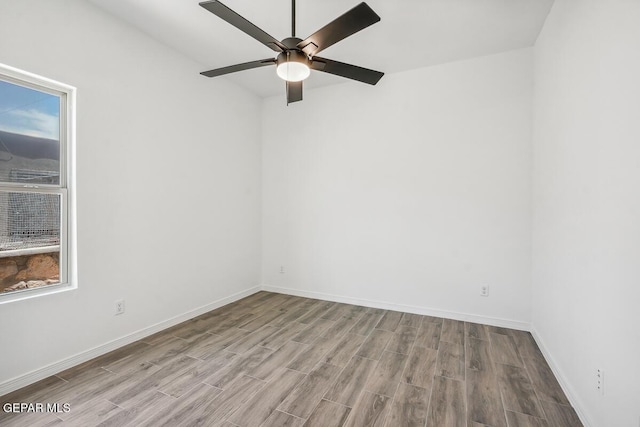 unfurnished room with ceiling fan and light hardwood / wood-style floors