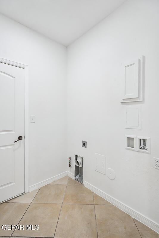 laundry room with hookup for a gas dryer, washer hookup, hookup for an electric dryer, and light tile patterned floors