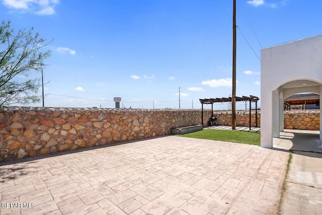 view of patio featuring a pergola