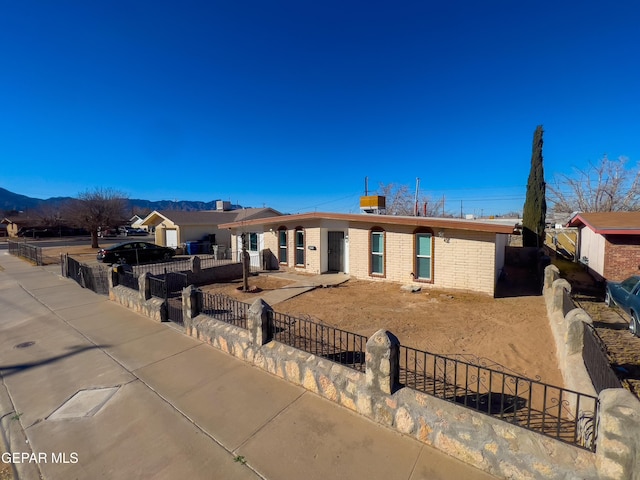 rear view of property with a mountain view