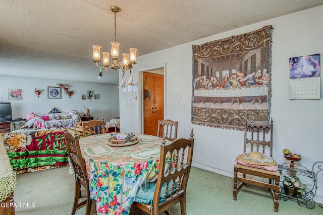 carpeted dining room with a textured ceiling and an inviting chandelier