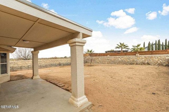 view of yard featuring a rural view and a patio area