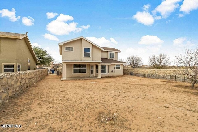 back of property featuring a rural view