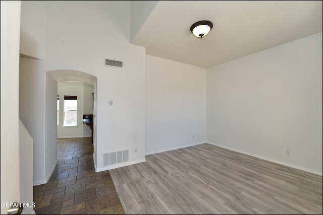 spare room with light wood-type flooring