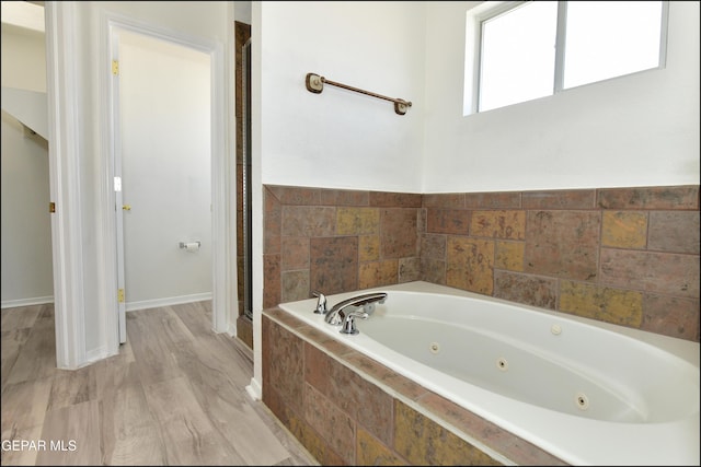 bathroom featuring plus walk in shower