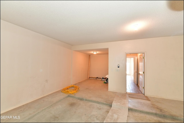 empty room with a textured ceiling