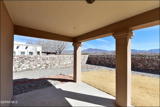 view of patio / terrace with a mountain view