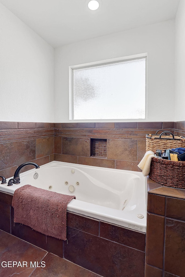 bathroom featuring tiled bath