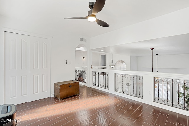 unfurnished room with ceiling fan and vaulted ceiling