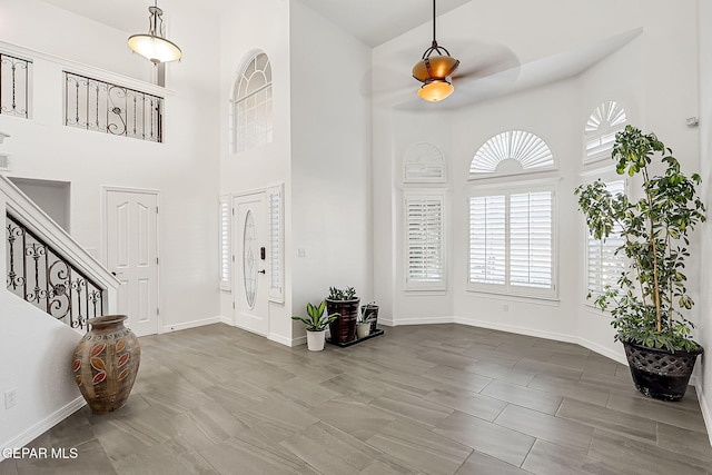 entrance foyer featuring a towering ceiling