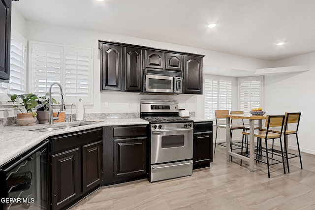 kitchen with appliances with stainless steel finishes and sink