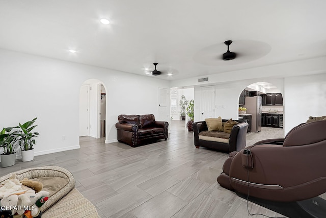 living room featuring ceiling fan