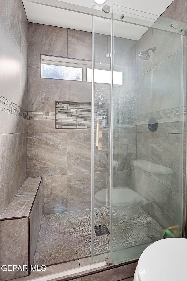 bathroom featuring an enclosed shower