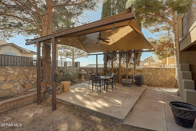 view of patio featuring ceiling fan