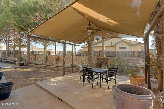 view of patio featuring ceiling fan