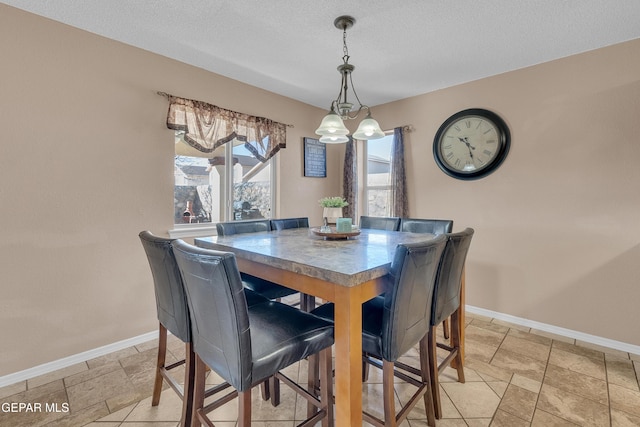 dining room with a textured ceiling