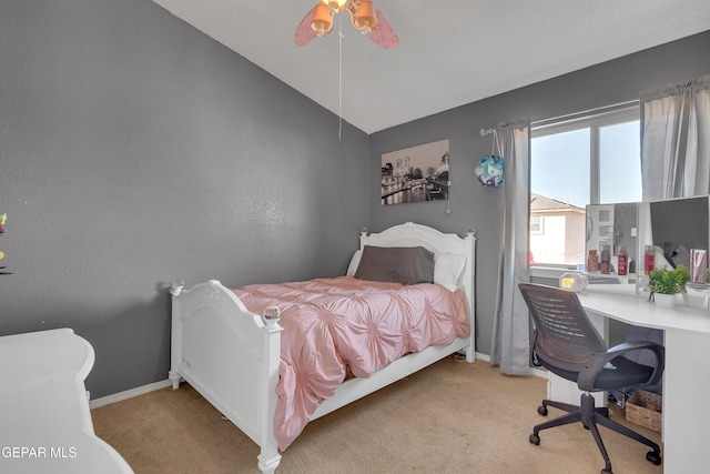 bedroom with lofted ceiling, light carpet, and ceiling fan