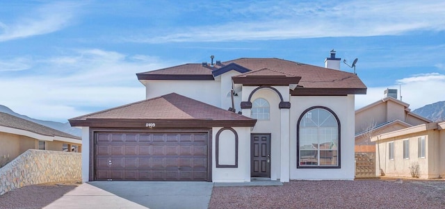 view of front of property with a garage