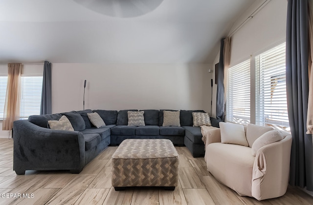 living room with lofted ceiling