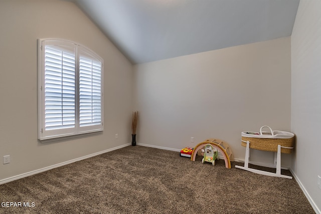 game room with vaulted ceiling and carpet