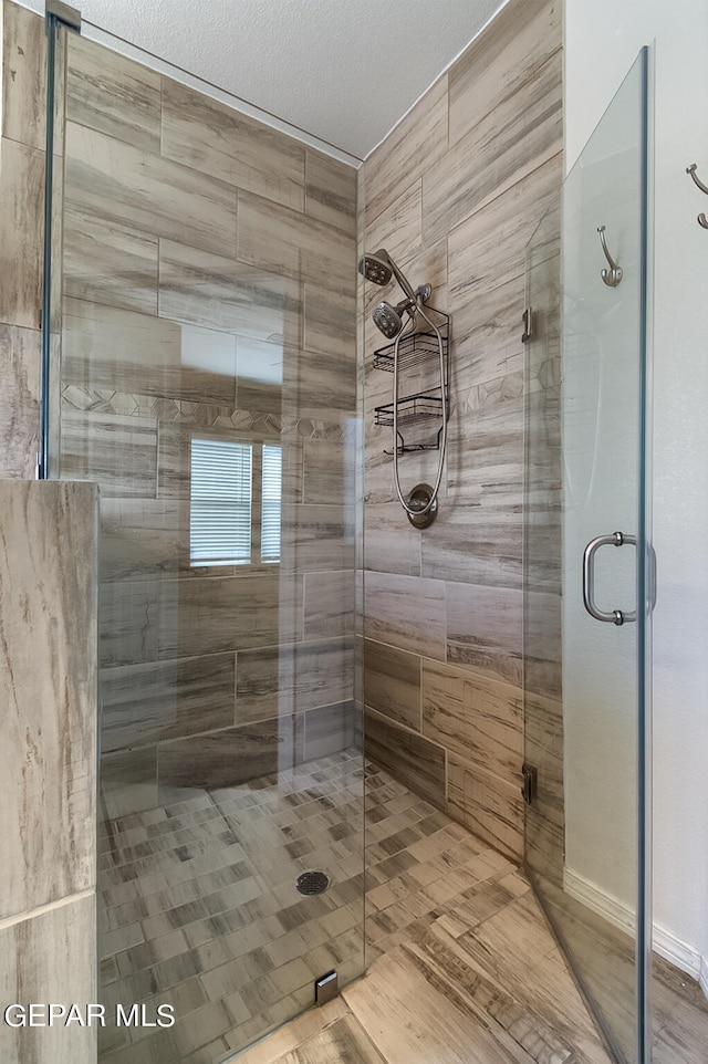 bathroom with an enclosed shower