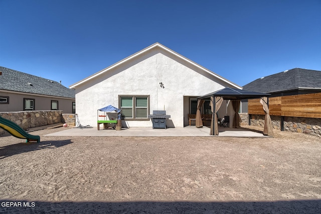 back of property with a patio