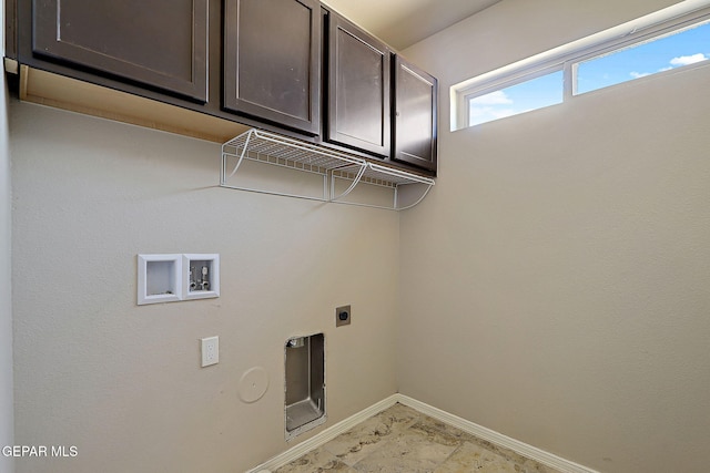 clothes washing area featuring cabinets, electric dryer hookup, and hookup for a washing machine