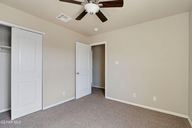 unfurnished bedroom featuring a closet, ceiling fan, and carpet flooring