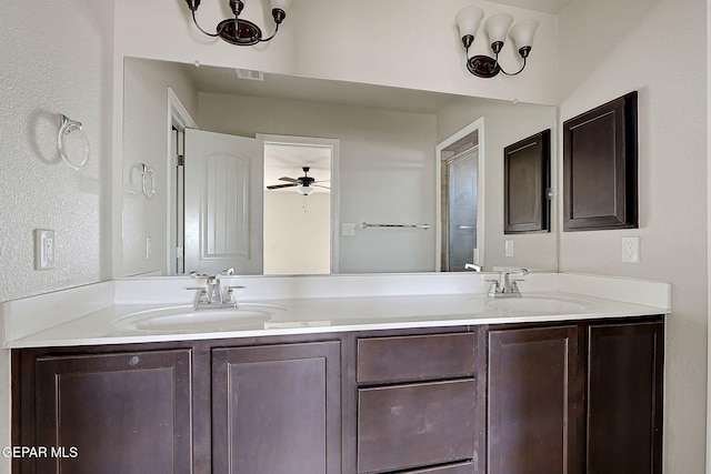 bathroom with ceiling fan and vanity