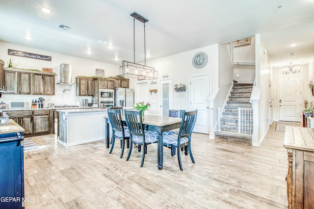 dining area featuring light wood-type flooring