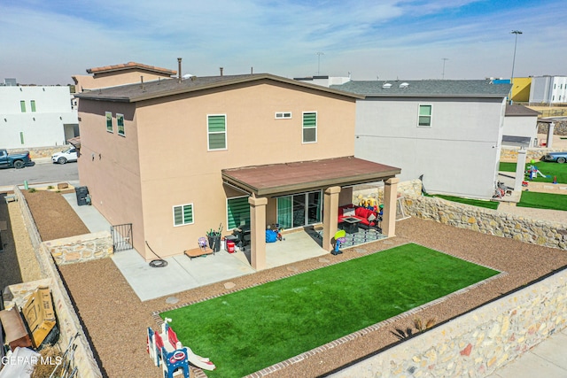 rear view of house featuring a patio