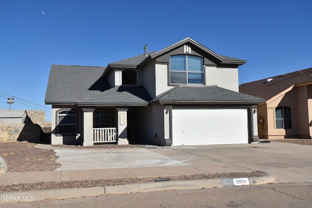 view of front of home featuring covered porch and a garage