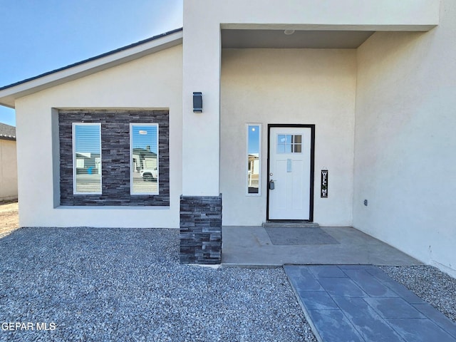 doorway to property with a patio