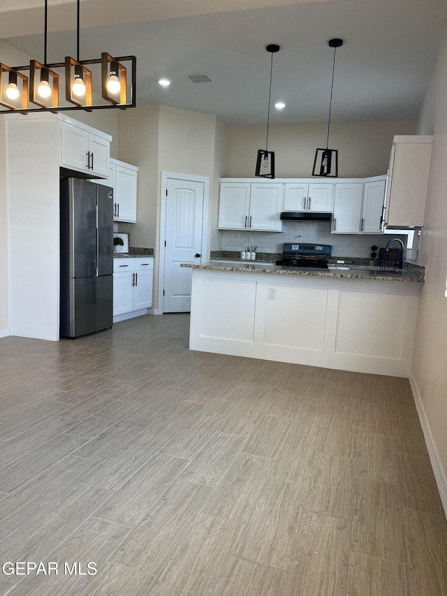 13345 Emerald Pearl Dr, Horizon City, TX 79928 - kitchen featuring stainless steel appliances, stone counters, light wood-style flooring, white cabinets, and recessed lighting