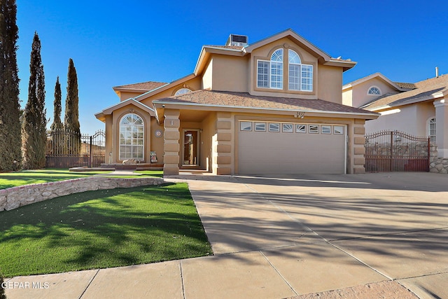 view of front facade with a garage and a front yard