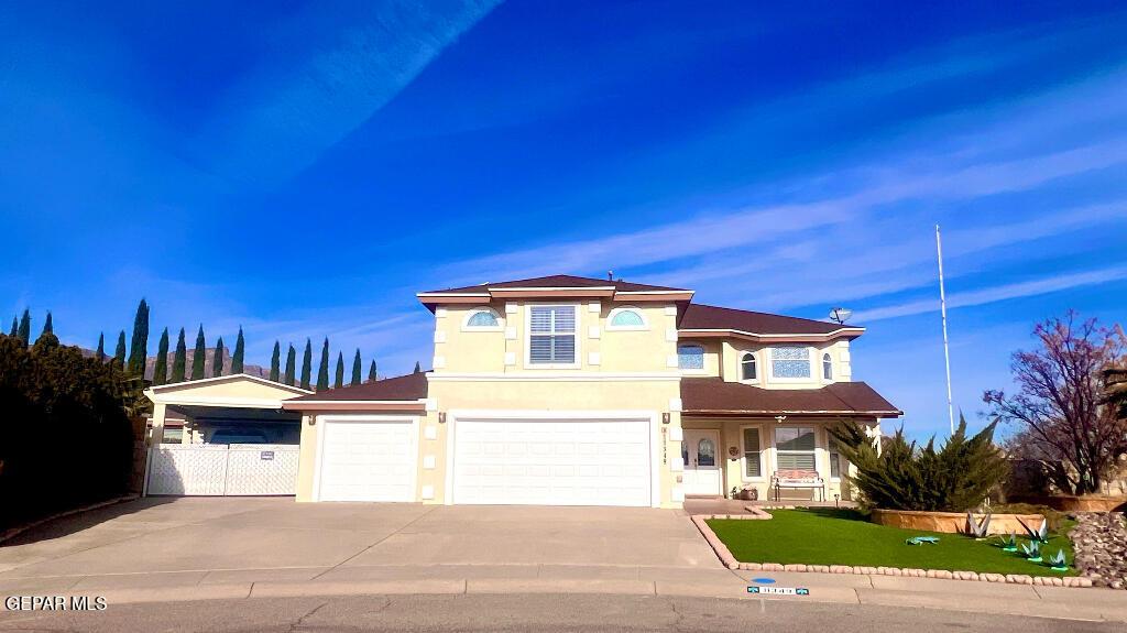 view of front of property with a garage