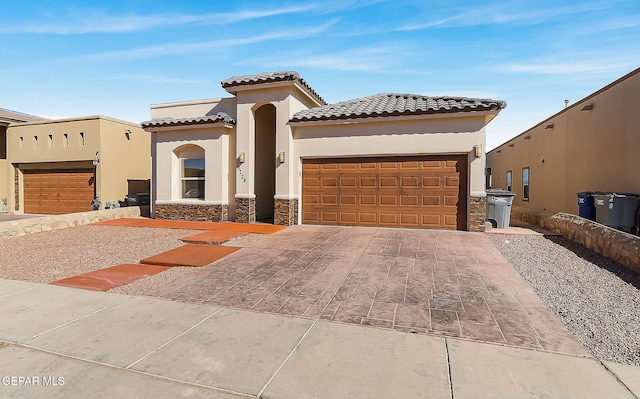 mediterranean / spanish-style house featuring a garage