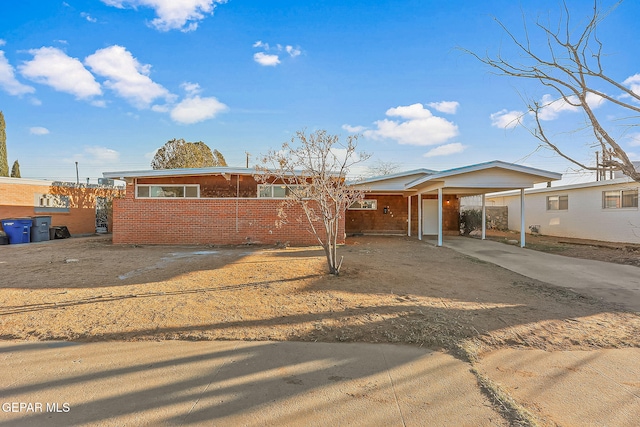 ranch-style house with a carport