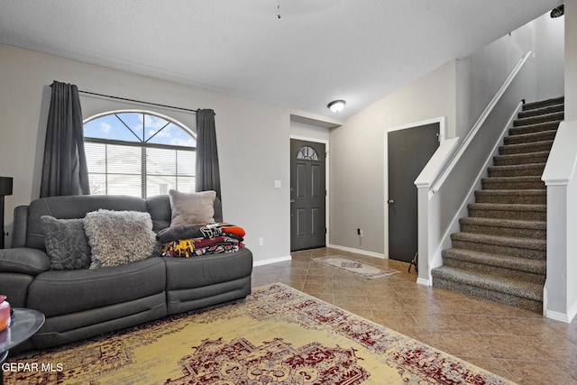 living room featuring tile patterned flooring and vaulted ceiling