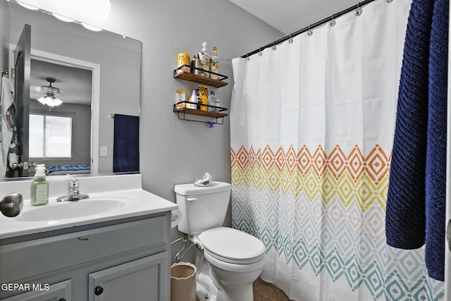 bathroom with vanity, toilet, and a shower with shower curtain