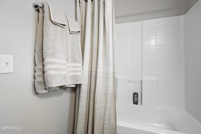 bathroom featuring shower / tub combo with curtain