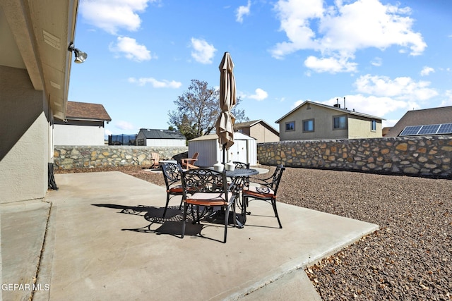 view of patio / terrace with a storage unit