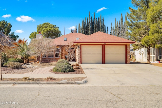 single story home featuring a garage