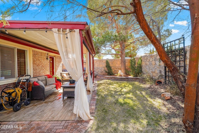 view of yard with a wooden deck and outdoor lounge area