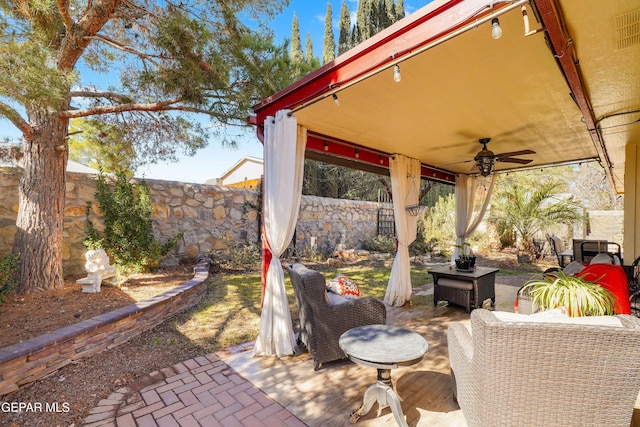 view of patio / terrace featuring an outdoor living space and ceiling fan