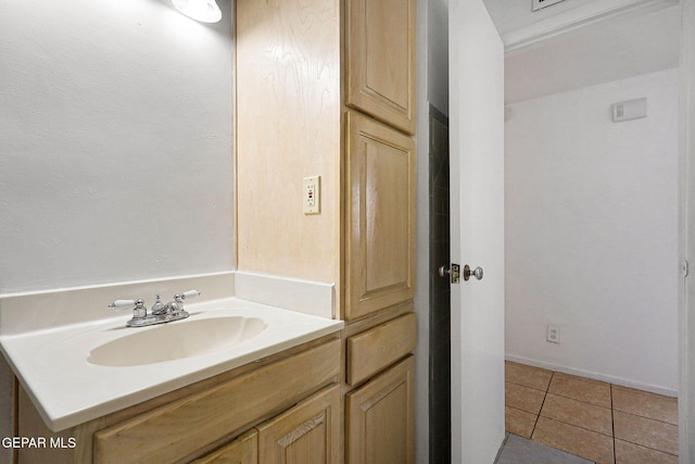 bathroom with tile patterned flooring and vanity