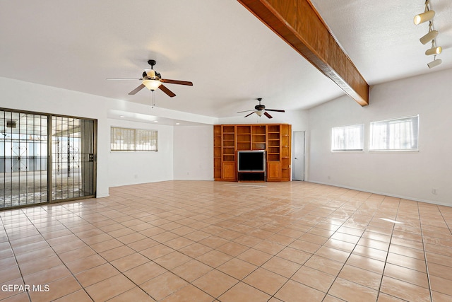 unfurnished living room featuring light tile patterned floors, a ceiling fan, beamed ceiling, a textured ceiling, and track lighting