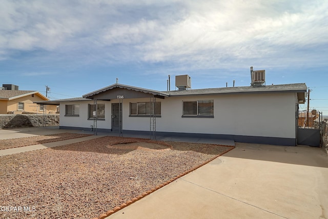 ranch-style home featuring a patio area and stucco siding