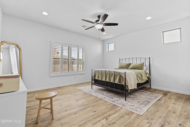 bedroom with light wood-style flooring, baseboards, and recessed lighting